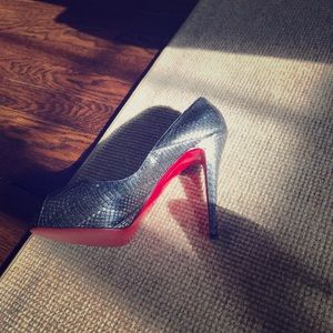 Christian Louboutin snake skin gunmetal pumps